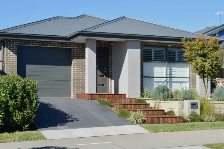 Homeowner reviewing Victorian building permit documents